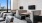 a room with a tv and chairs