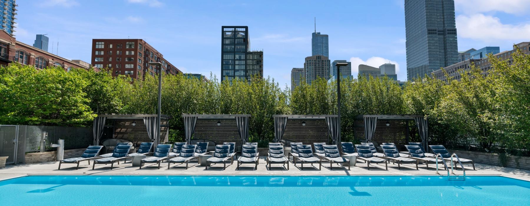 a pool with chairs around it