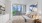 a bedroom with a large window