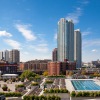 a pool with buildings in the background