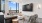 a living room with a tv and chairs